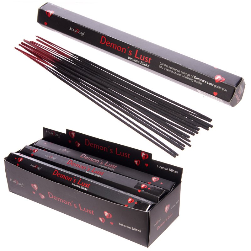 Black incense sticks, 12 hand‑rolled sticks arranged on a flat surface, showcasing a dark, smooth texture